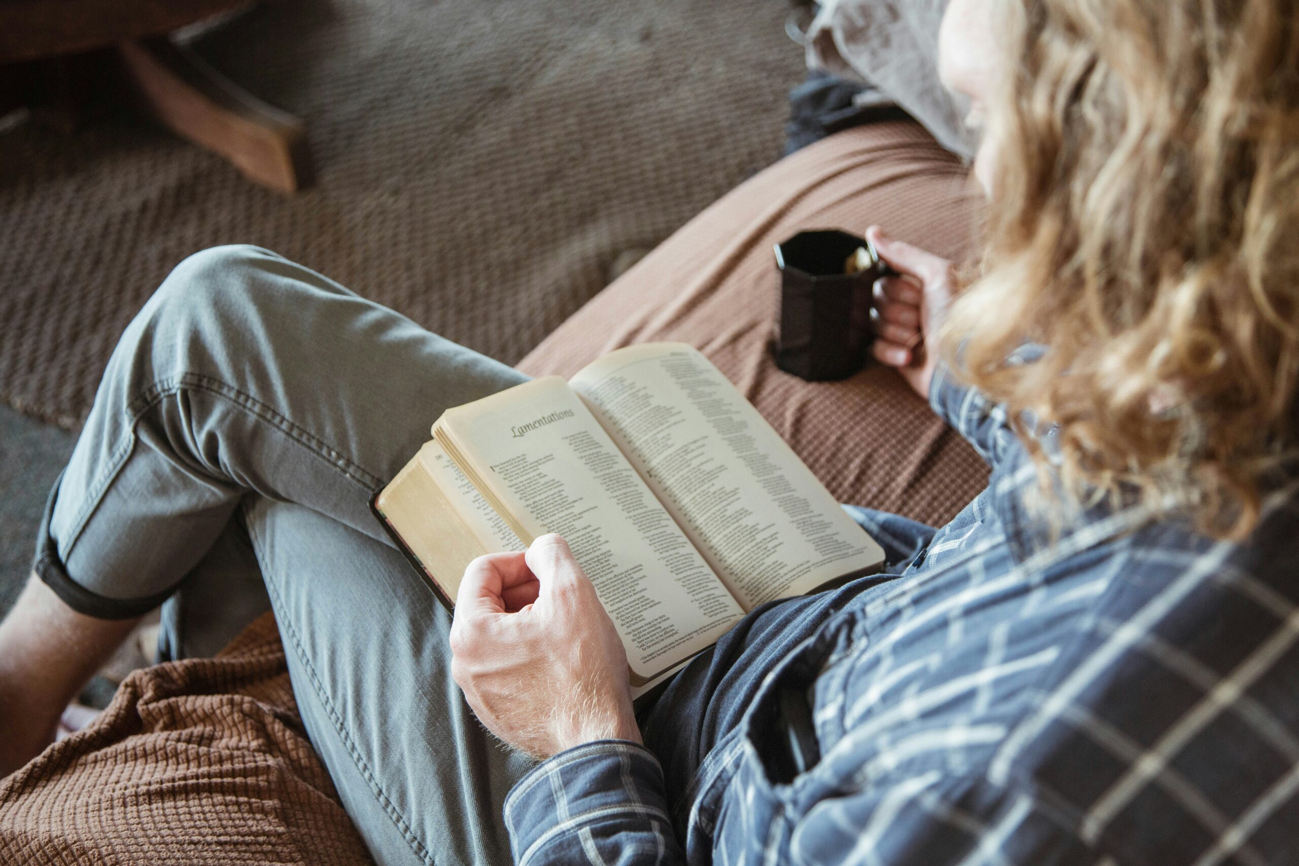 Person relaxing without a smartphone, representing digital detox and mindful living